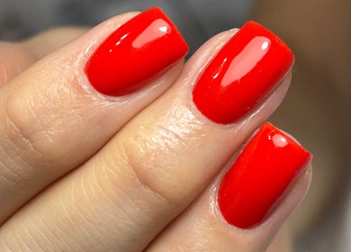 Bold red manicure at Nails by Aims Xo in Bolsover, England, GB showcasing vibrant and stylish nail art.