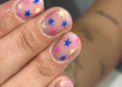 Colorful starry manicure at Nails by Aims Xo, Bolsover, England, GB, showcasing unique nail art.