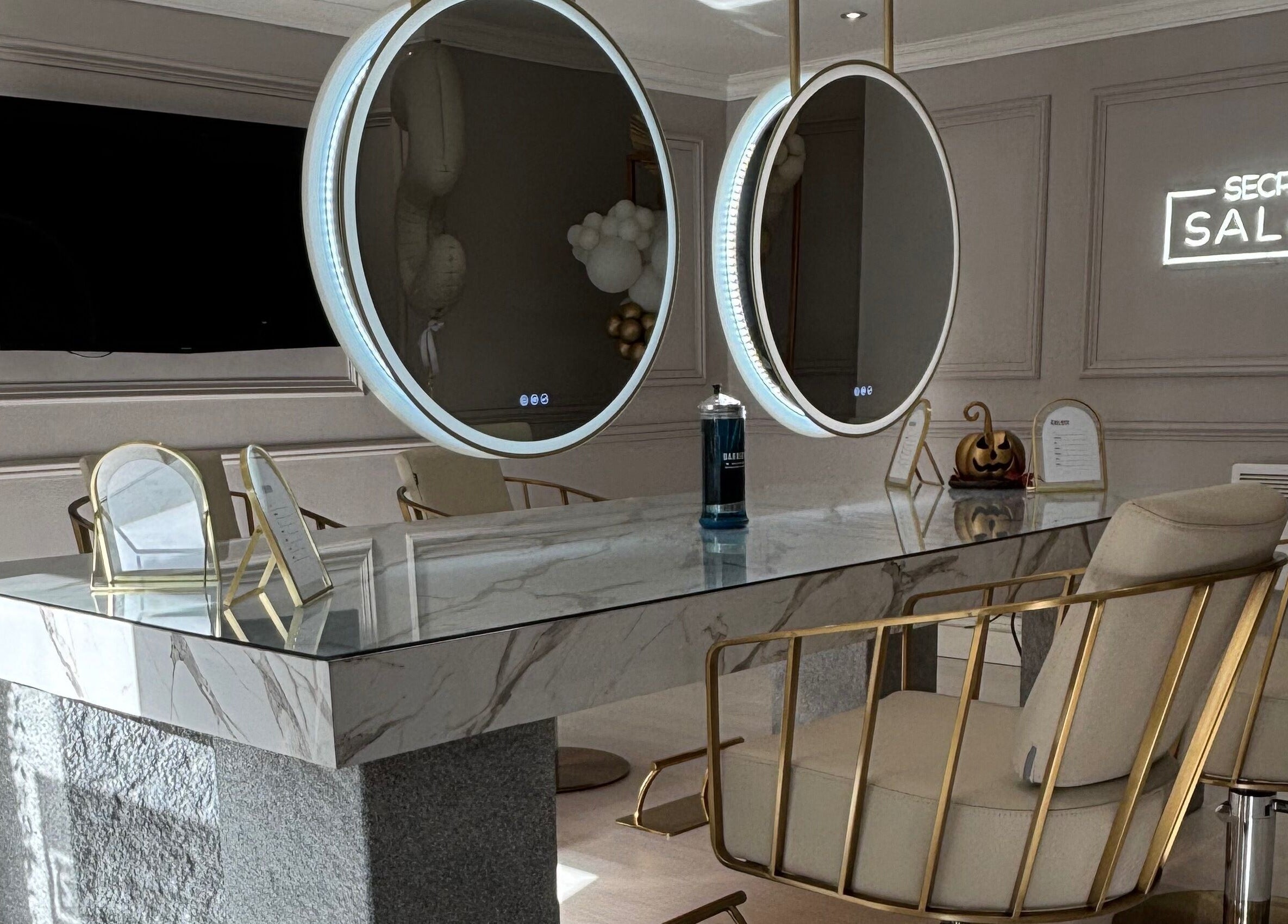 Chic interior of Secret Salon in Pucklechurch, England with elegant decor and stylish mirrors.