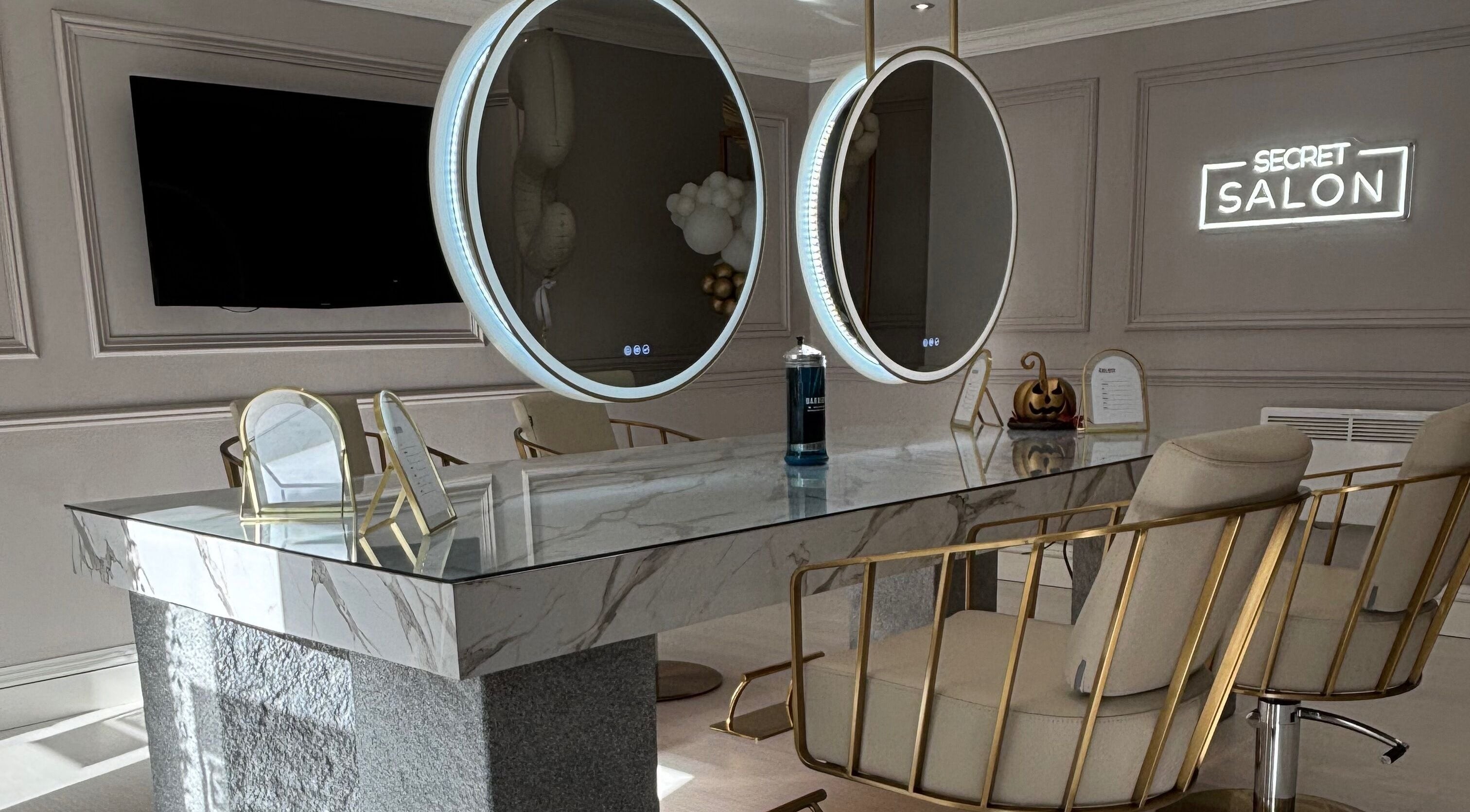 Chic interior of Secret Salon in Pucklechurch, England with elegant decor and stylish mirrors.