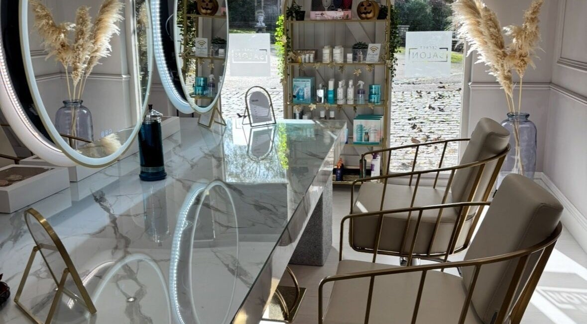 Luxurious marble counter and stylish chairs at Secret Salon, Pucklechurch, England, GB. Elegant mirrors enhance ambiance.