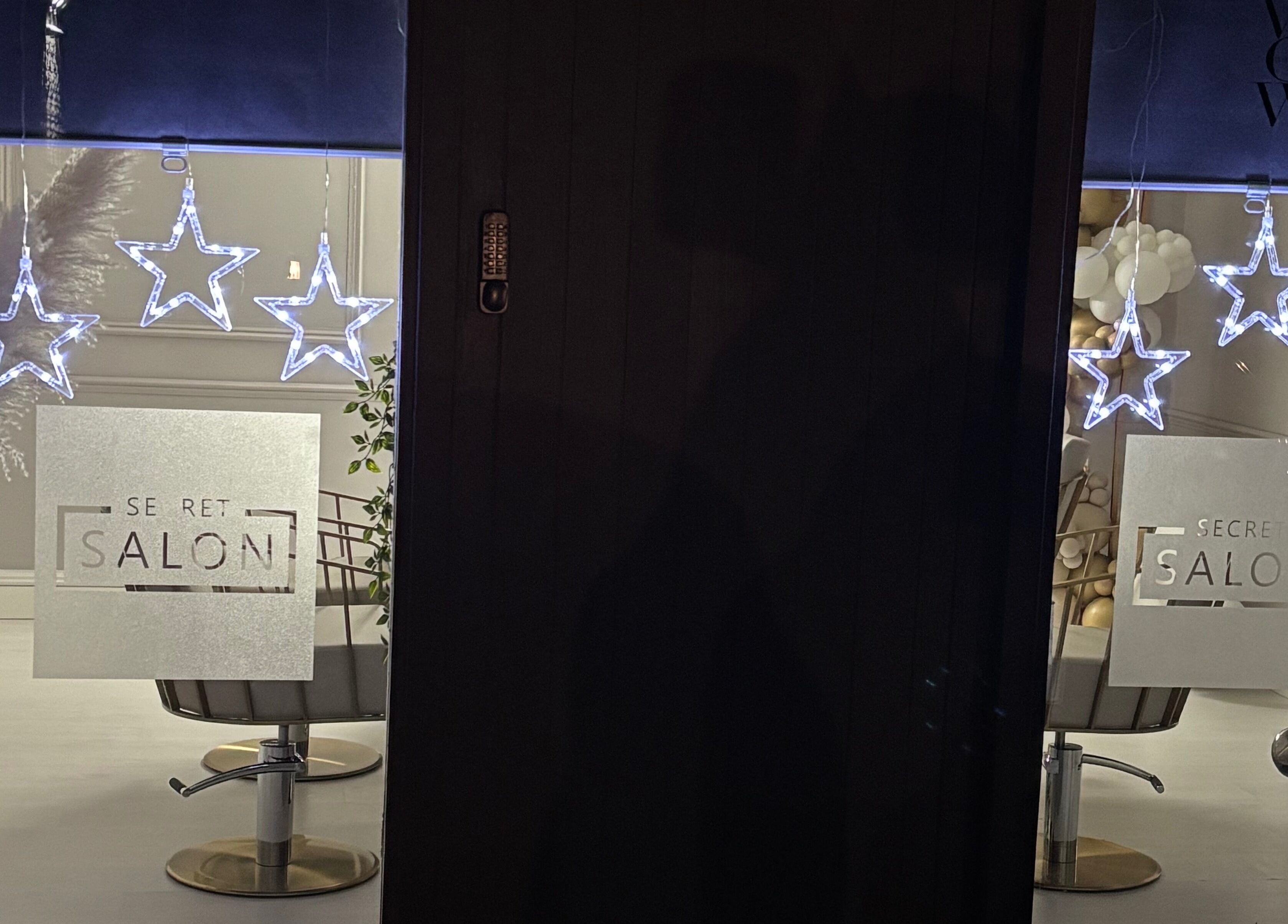 Illuminated star lights at Secret Salon entrance in Pucklechurch, England, GB.