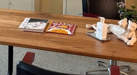 Tabletop at Salon Spaghetti, Melbourne, Victoria, AU with decor and books.