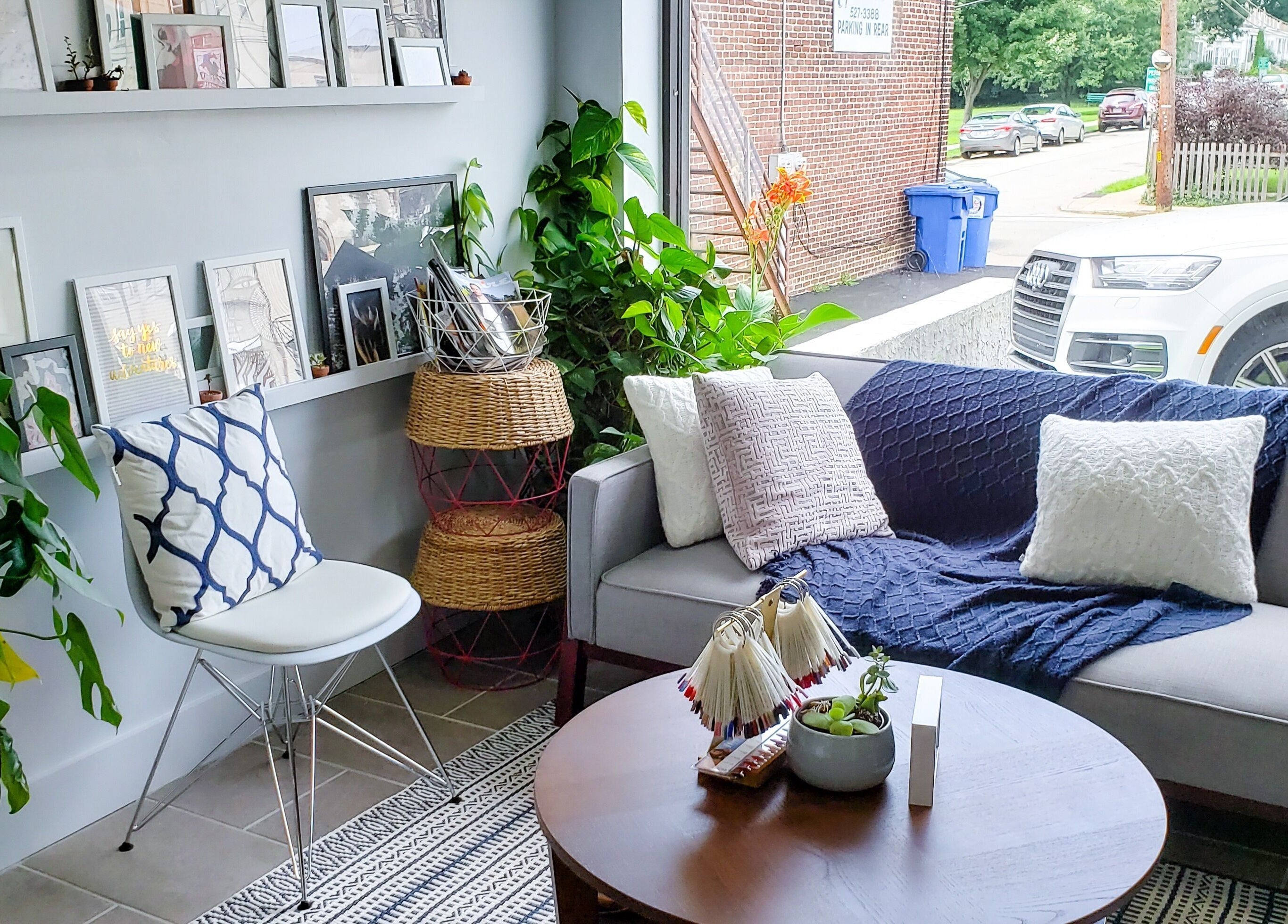 Relaxing chic lounge area at Top Coat Nail Studio, Bryn Mawr, Pennsylvania, US with comfortable seating.