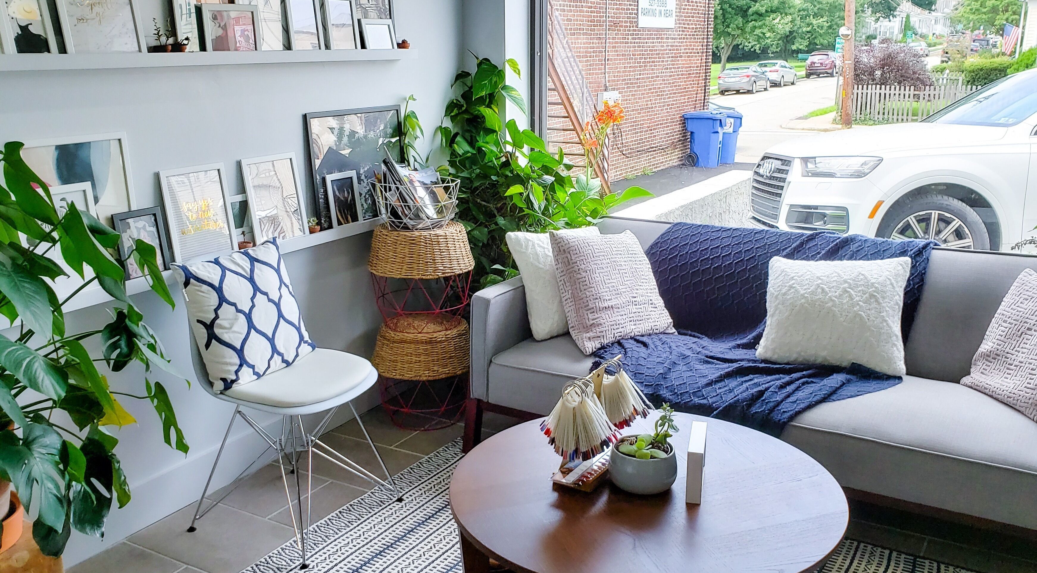 Relaxing chic lounge area at Top Coat Nail Studio, Bryn Mawr, Pennsylvania, US with comfortable seating.