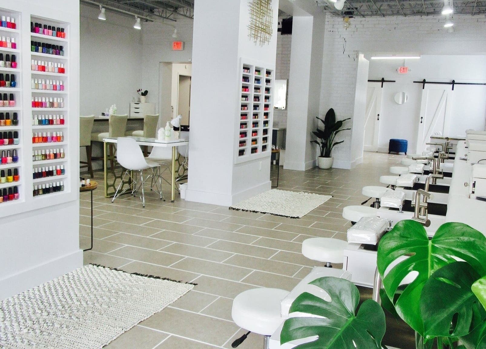 Modern interior of Top Coat Nail Studio in Bryn Mawr, Pennsylvania, US featuring elegant nail polish displays.