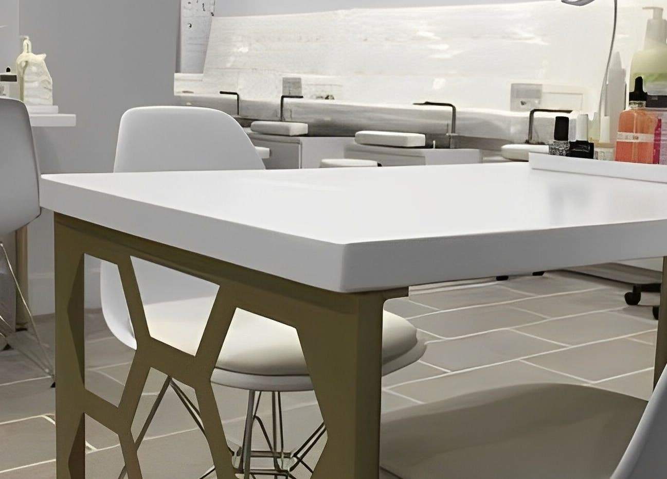 Modern nail station at Top Coat Nail Studio in Bryn Mawr, Pennsylvania, US, featuring sleek design and comfortable seating.