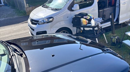 CRV Mobile Valeting services van set up on street in Ware, England, GB, showcasing cleaning equipment.