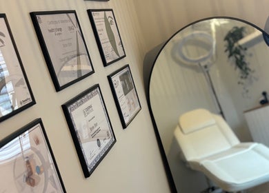Certificates on display and treatment chair at The Coggeshall Skin Clinic, Coggeshall, England, GB.