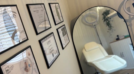 Certificates on display and treatment chair at The Coggeshall Skin Clinic, Coggeshall, England, GB.