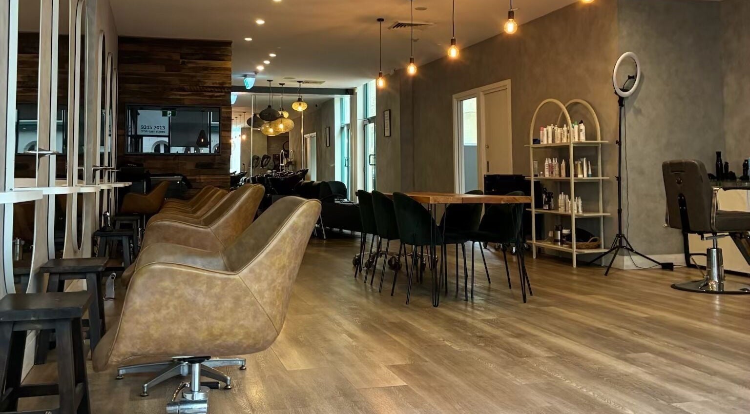 Elegant interior of Moss Hair Artistry - Coogee, Coogee, New South Wales, AU showcasing modern chairs and decor.