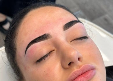 Close-up of freshly shaped eyebrows at By Your Girl Emma, Melbourne, Victoria, AU, highlighting beauty services.