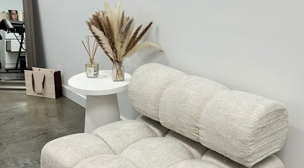 Elegant lounge chair in serene corner at By Your Girl Emma, Melbourne, Victoria, AU with pampas on side table.