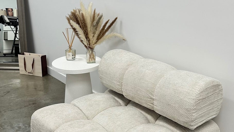 Elegant seating area at By Your Girl Emma, Melbourne, Victoria, AU with modern decor and plush textures.