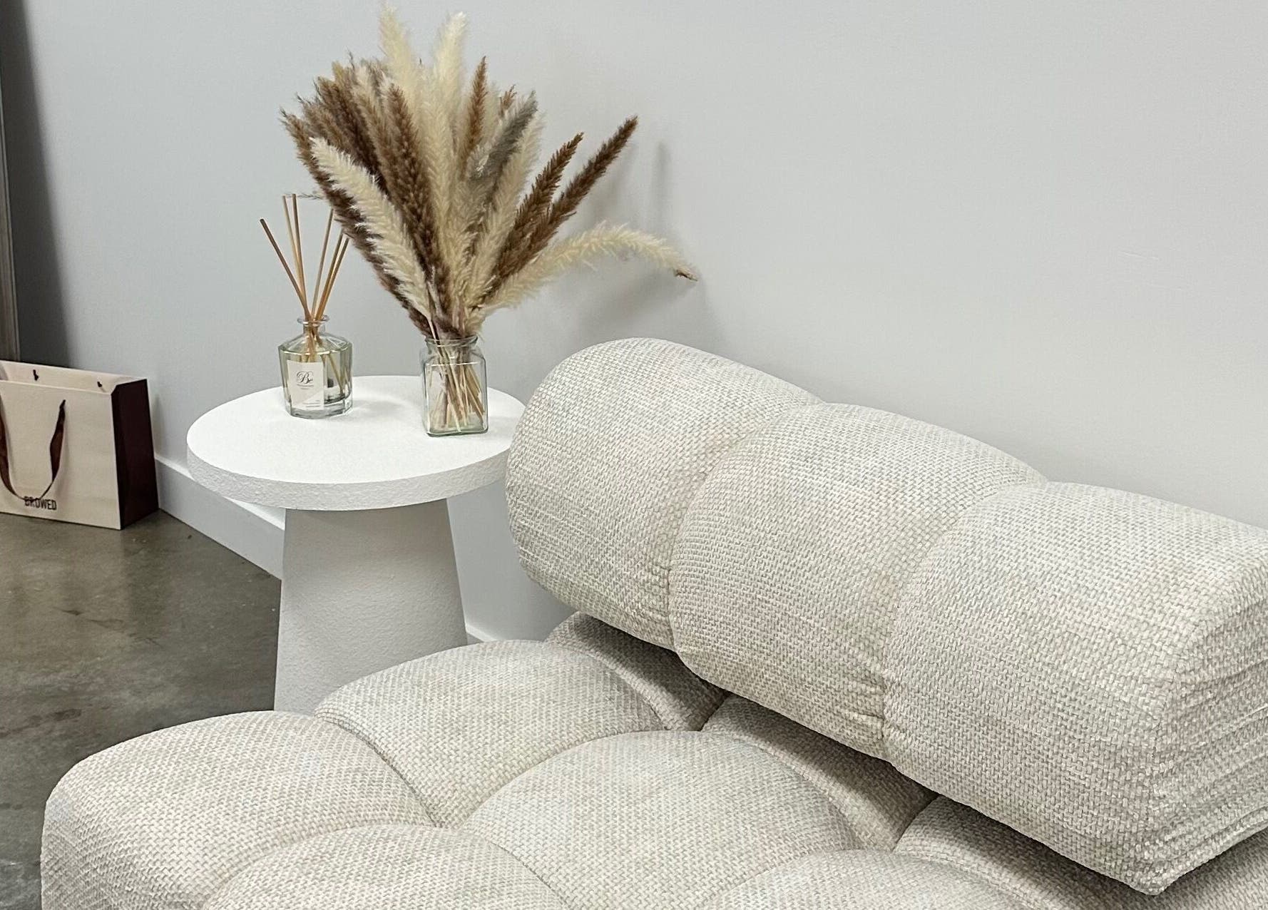 Elegant seating area at By Your Girl Emma, Melbourne, Victoria, AU with modern decor and plush textures.