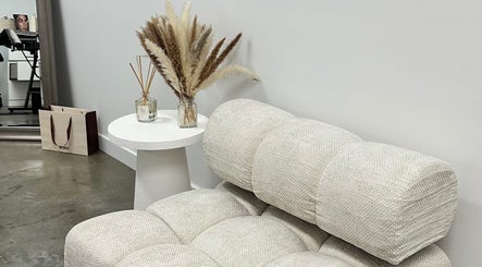 Elegant seating area at By Your Girl Emma, Melbourne, Victoria, AU with modern decor and plush textures.