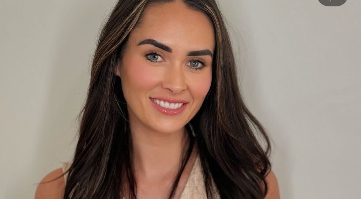 Woman with radiant smile at By Your Girl Emma, Melbourne, Victoria, AU showcasing beauty and wellness.