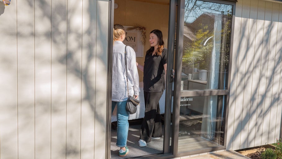 Customer greeted warmly at Bloom Boutique Beauty's entrance in Dunedin, Otago, NZ on a sunny day.