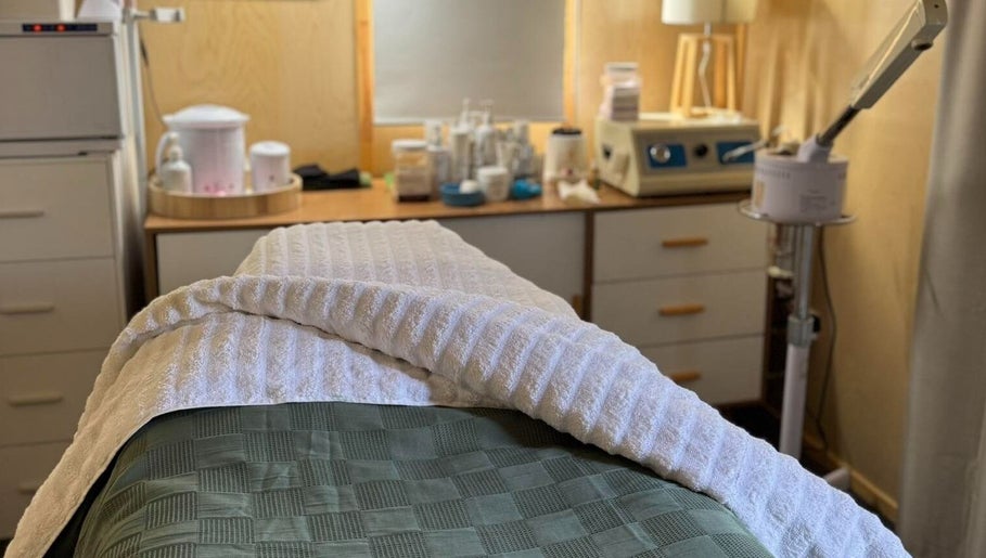 Relaxing treatment room at Bloom Boutique Beauty, Dunedin, Otago, NZ equipped with spa essentials.