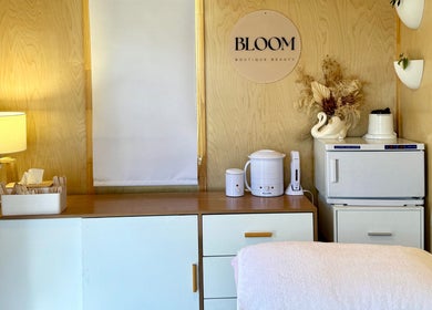 Relaxing treatment room at Bloom Boutique Beauty, Dunedin, Otago, NZ, featuring elegant decor and gentle lighting.