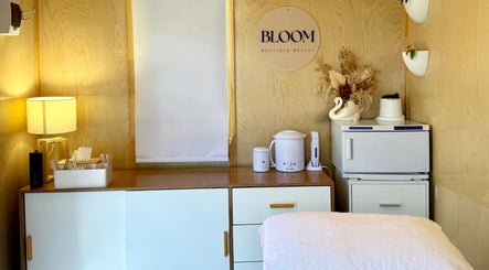 Relaxing treatment room at Bloom Boutique Beauty, Dunedin, Otago, NZ, featuring elegant decor and gentle lighting.