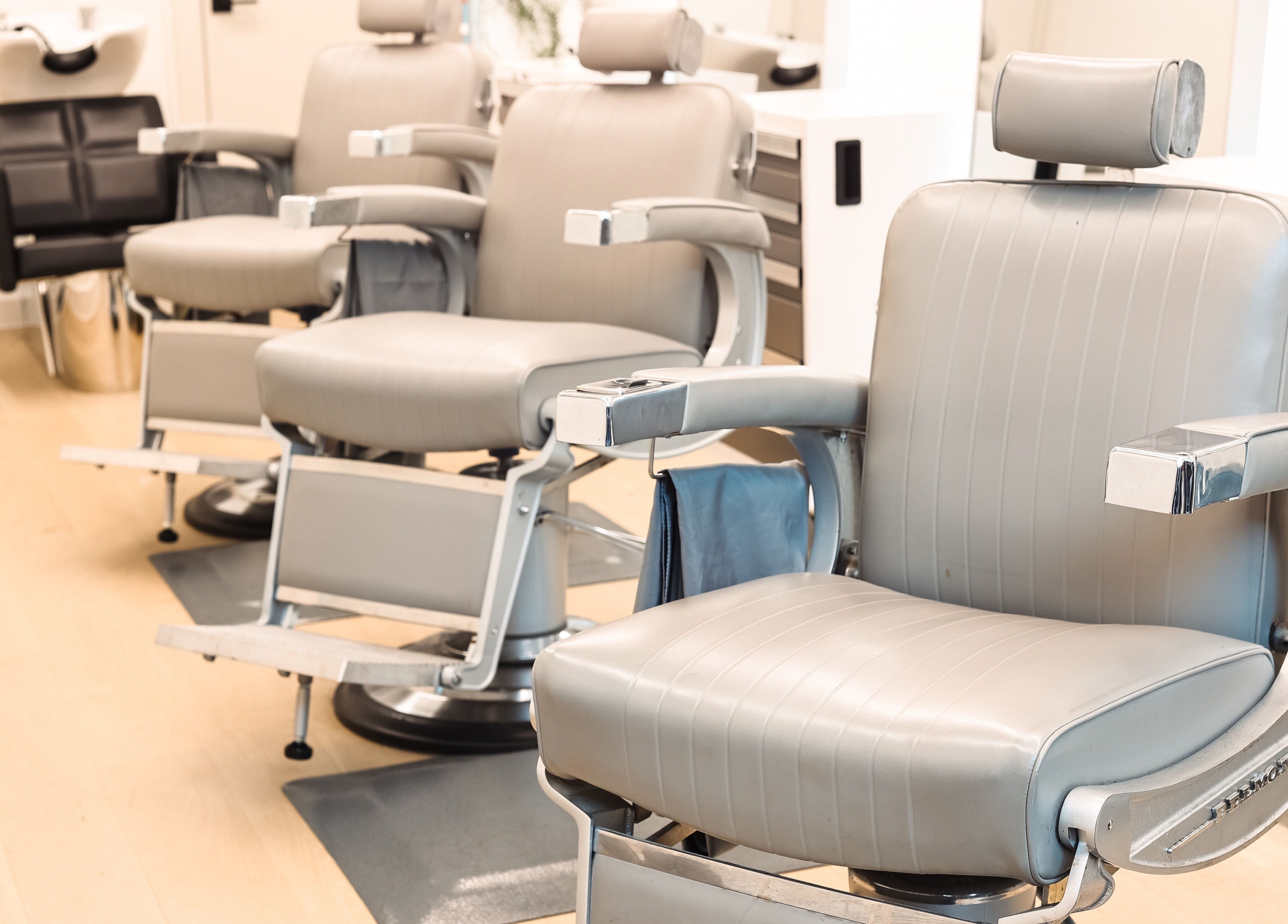 Modern salon chairs at CABELLO BROOKLYN, New York, New York, US. Comfortable setting for a premium experience.