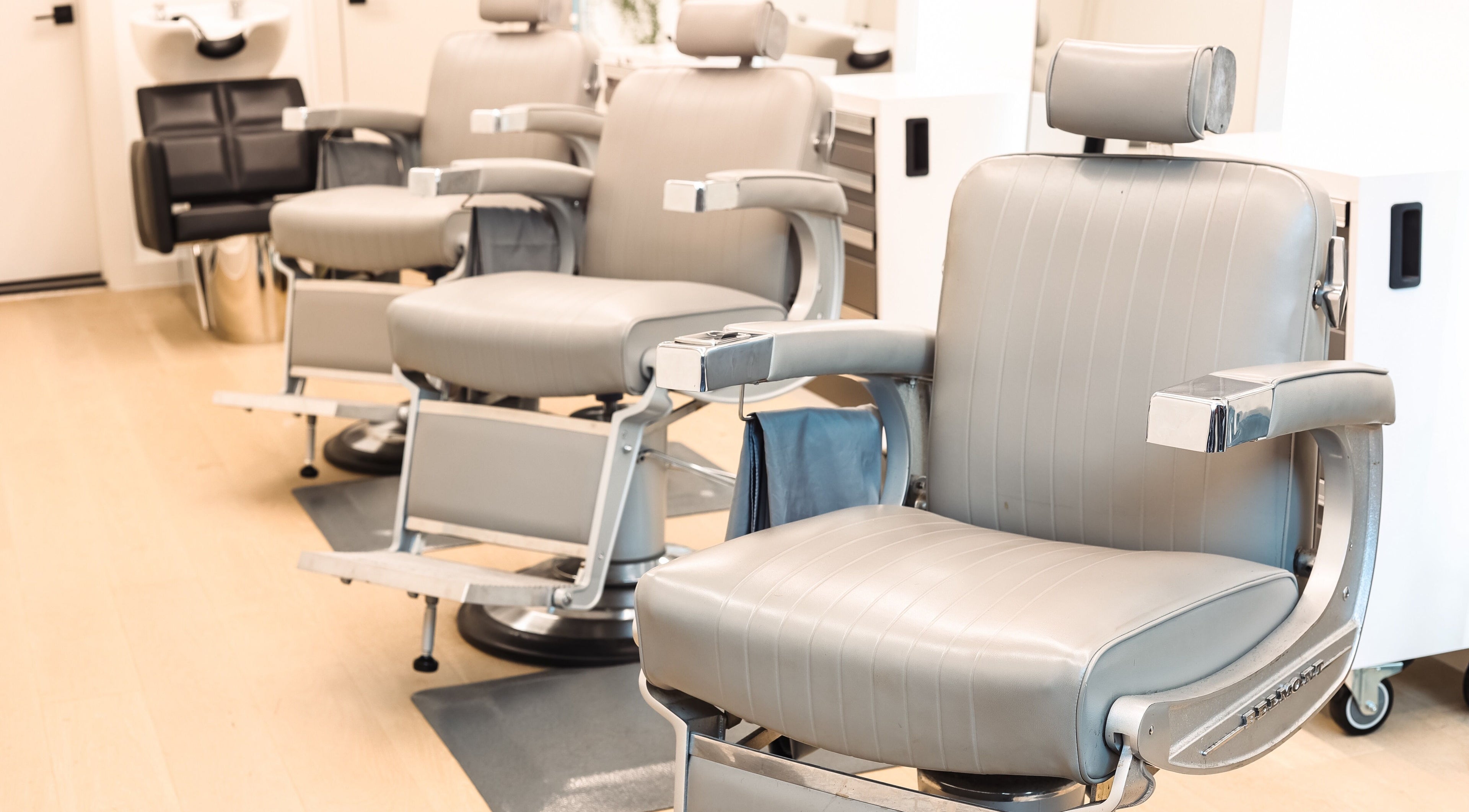 Modern salon chairs at CABELLO BROOKLYN, New York, New York, US. Comfortable setting for a premium experience.
