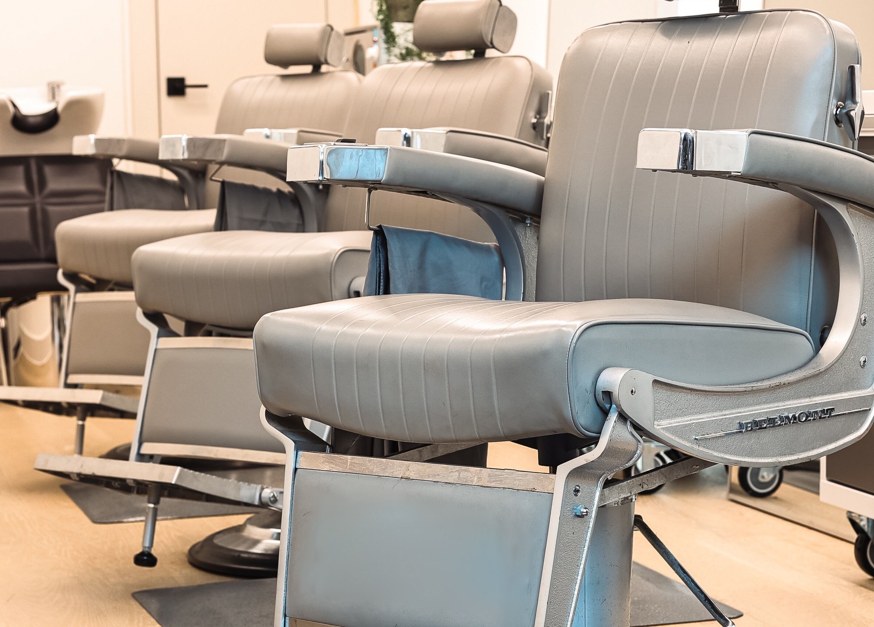 Modern barber chairs at CABELLO BROOKLYN, New York, New York, US. Comfortable seating for premium grooming services.