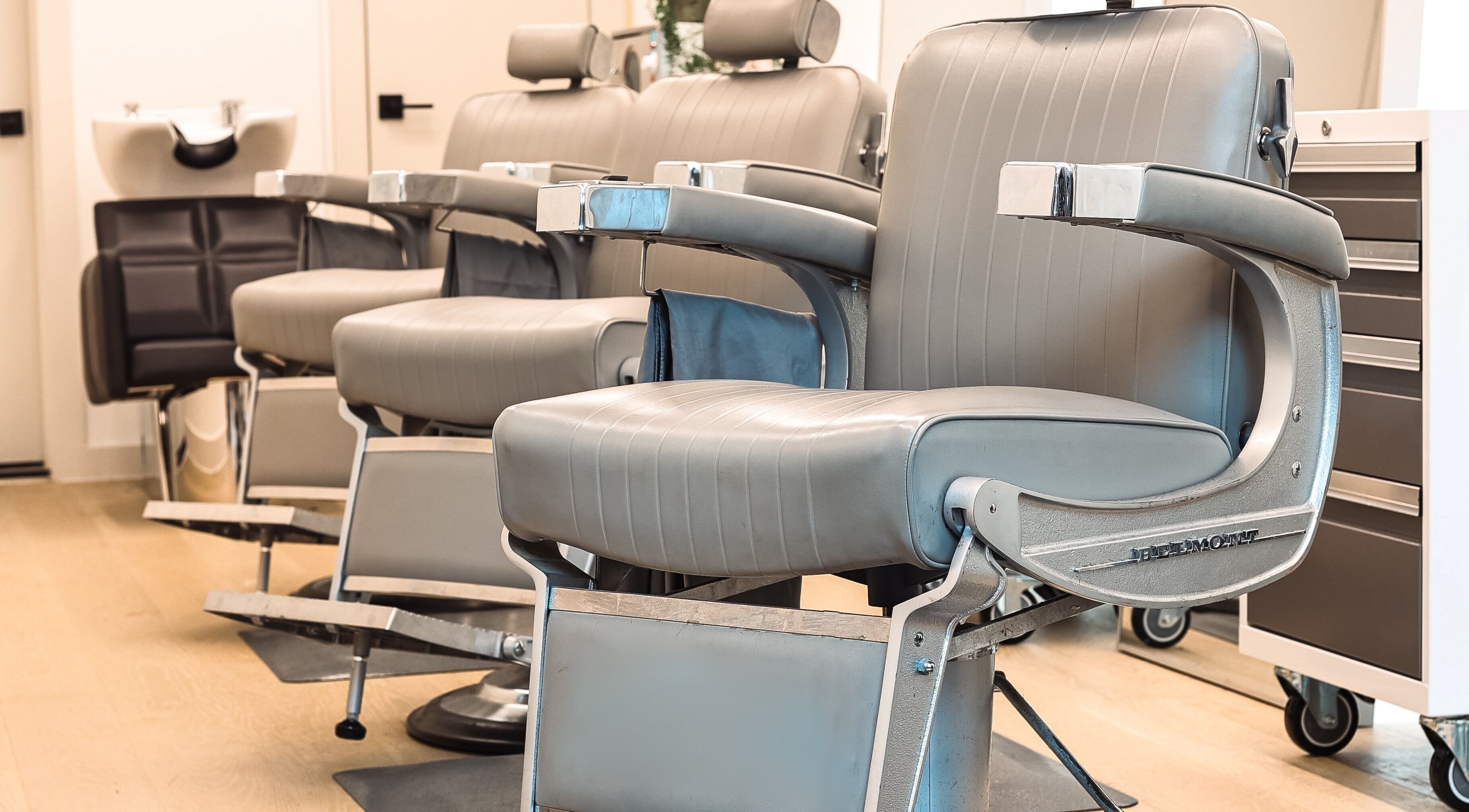 Modern barber chairs at CABELLO BROOKLYN, New York, New York, US. Comfortable seating for premium grooming services.