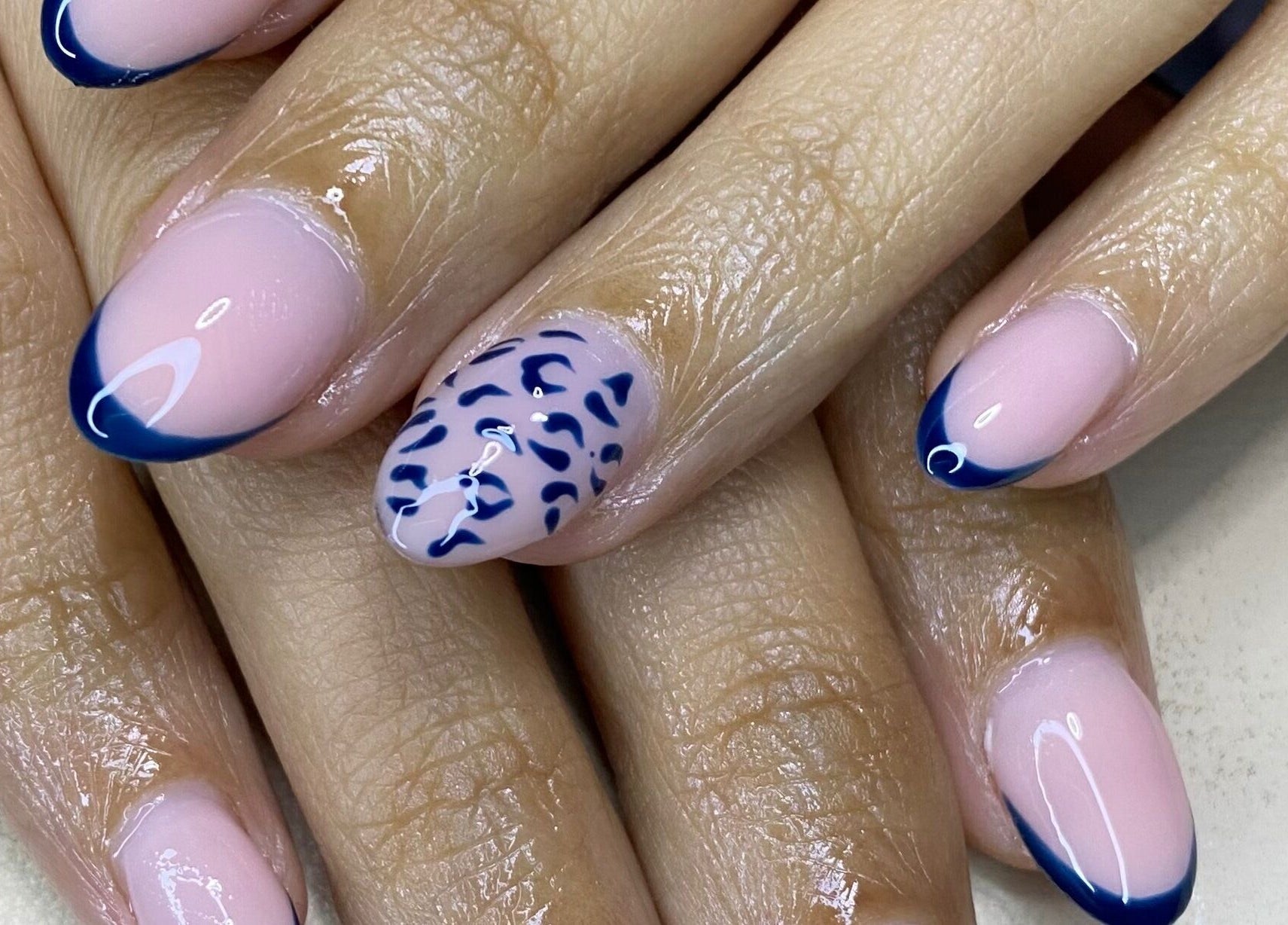 Elegant blue-tipped nails with unique design at The Glamorium, Cultuurtuin, Paramaribo, SR.