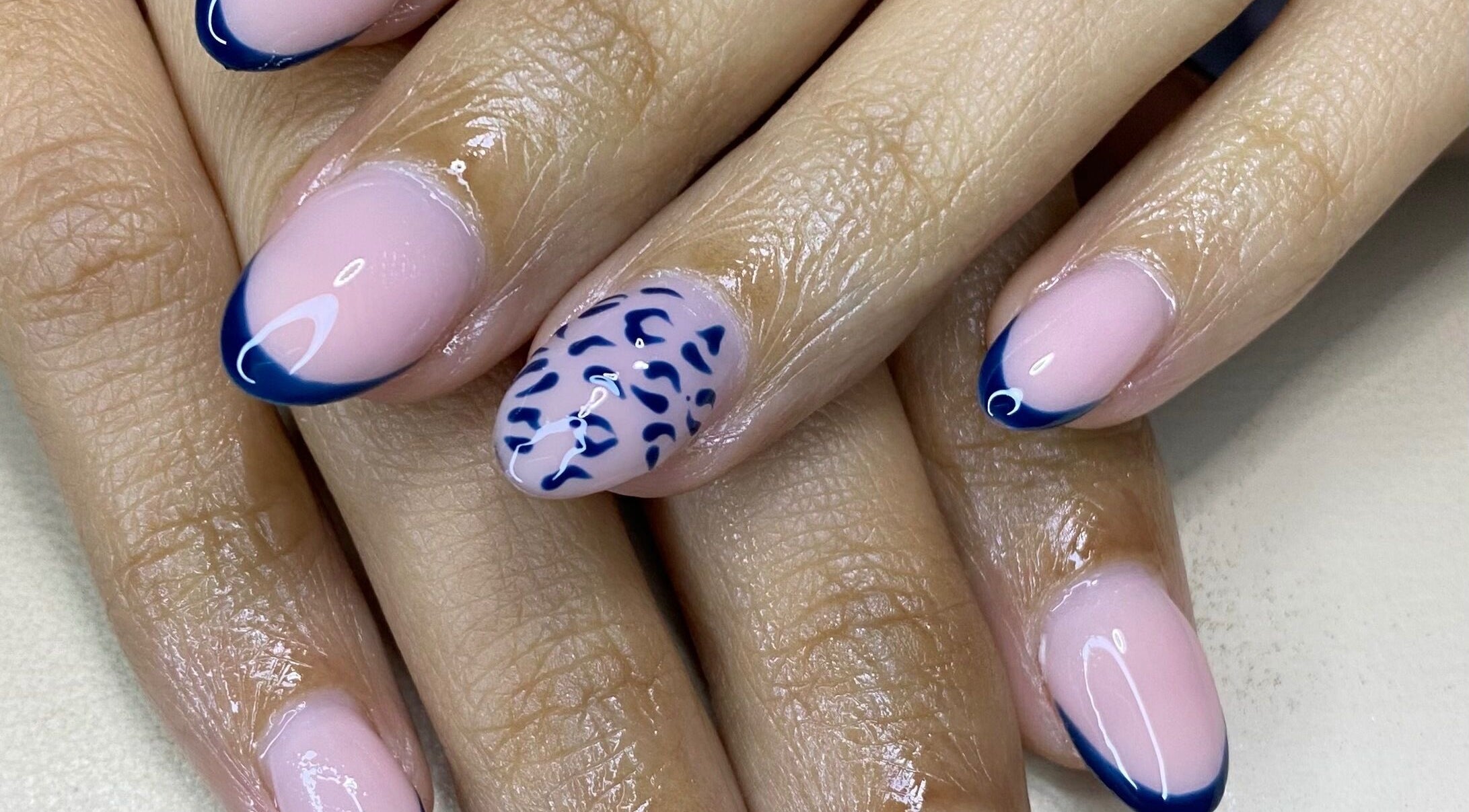 Elegant blue-tipped nails with unique design at The Glamorium, Cultuurtuin, Paramaribo, SR.