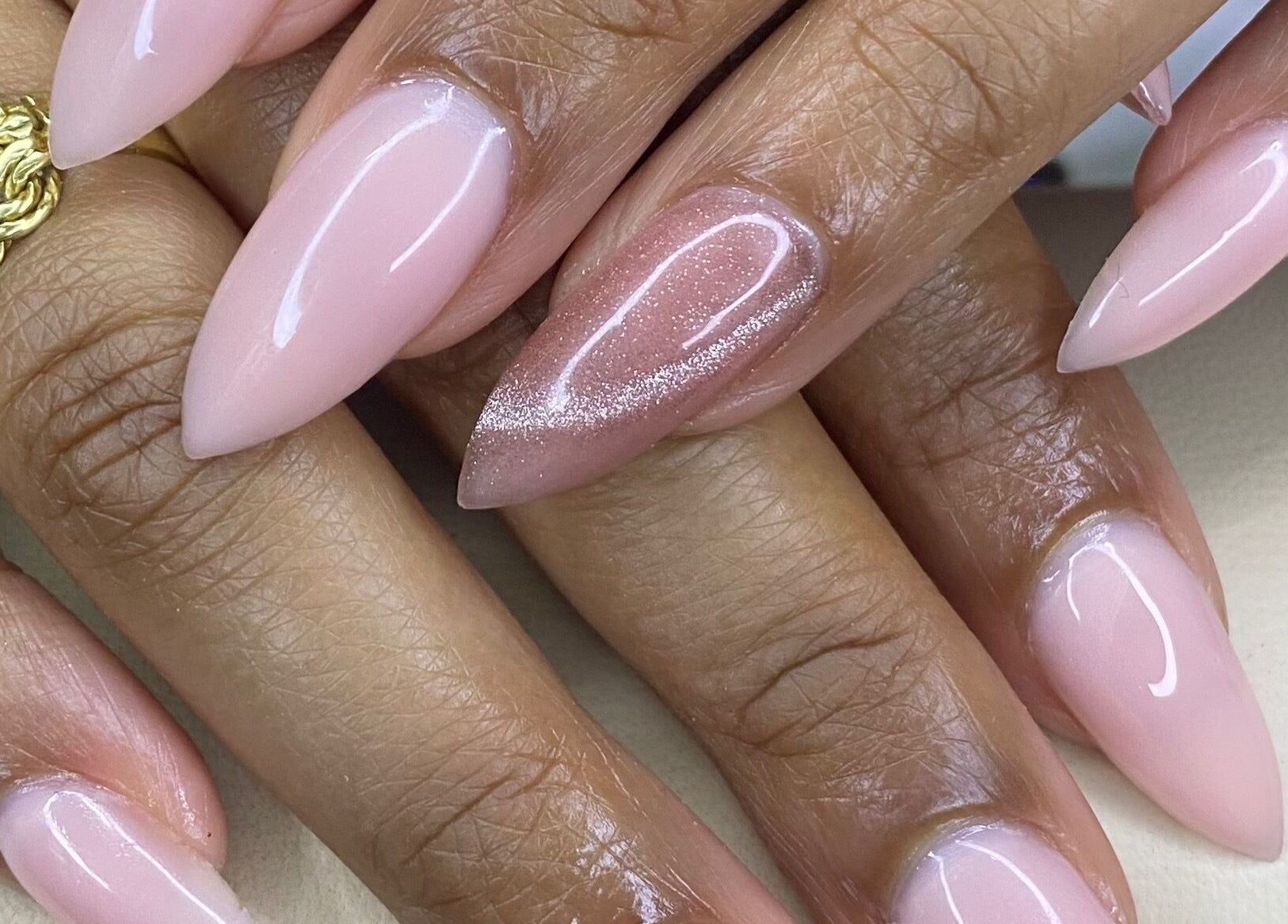 Stylish pink manicure at The Glamorium, Cultuurtuin, Paramaribo, SR adds a touch of elegance.