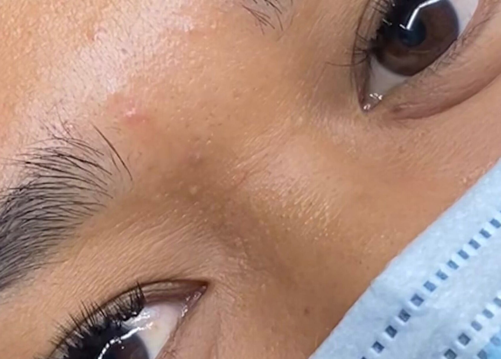 Close-up of a client's eyes undergoing a beauty treatment at The Glamorium, Cultuurtuin, Paramaribo, SR.