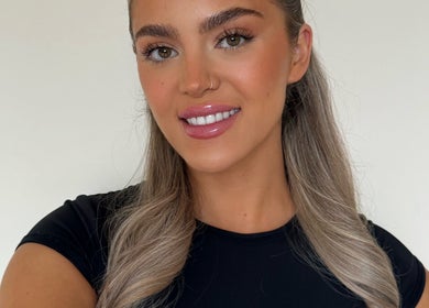 Smiling woman with flawless makeup at Skin Aesthetics by Becki in Truro, England, GB.