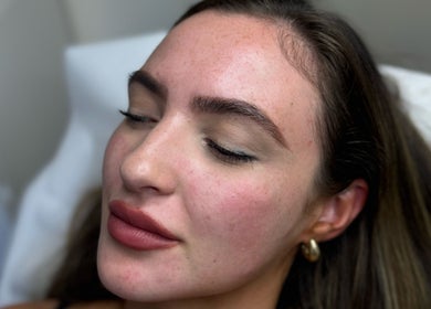 Relaxed woman enjoying a facial treatment at Skin Aesthetics by Becki Penzance, Penzance, England, GB.