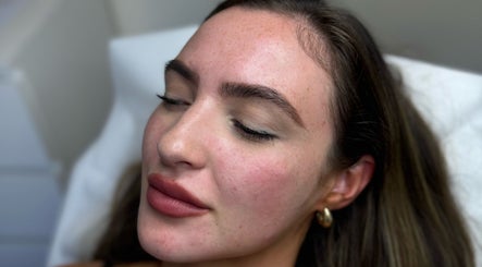 Relaxed woman enjoying a facial treatment at Skin Aesthetics by Becki Penzance, Penzance, England, GB.