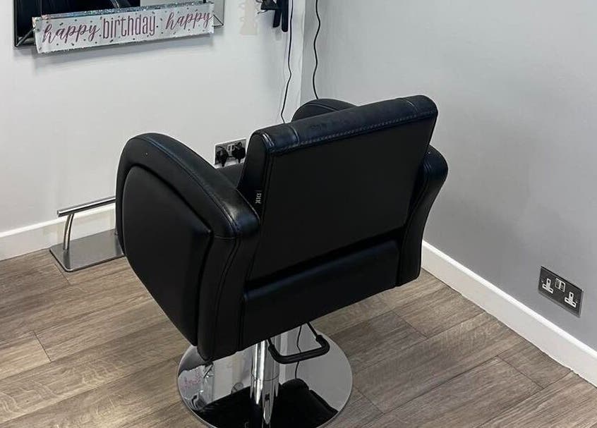 Modern salon chair at Hair at 12b, Seaton, England, GB offering comfort and style.