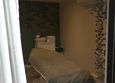 Relaxing treatment room at Nicola's Nails and Beauty, Whitchurch, England, GB, featuring a massage table.