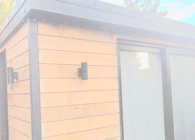 Modern wood-paneled exterior of Nicola's Nails and Beauty in Whitchurch, England, GB.
