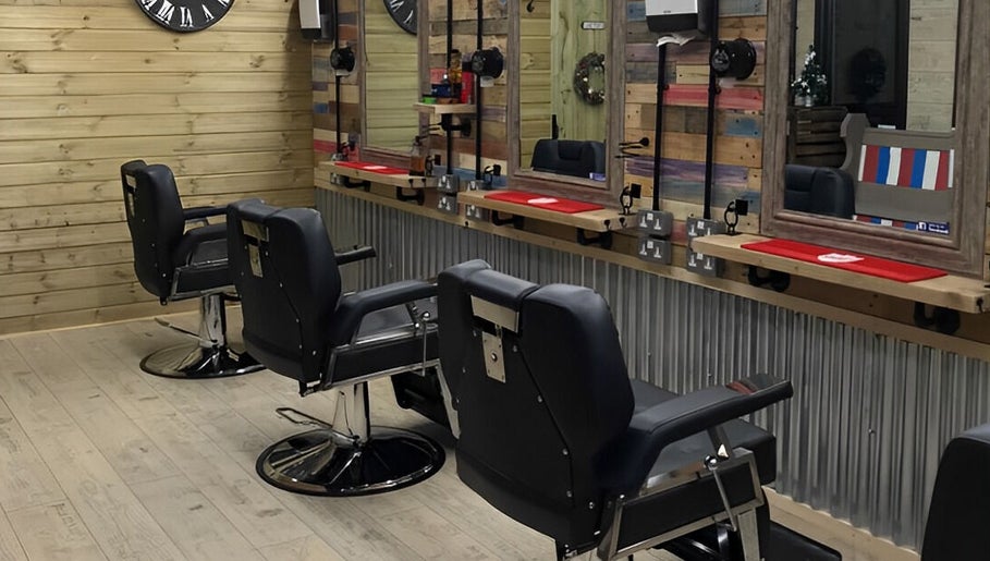 Stylish barber chairs at The Barber Shack, Saint Martin's, England, GB. Rustic wooden decor adds charm.