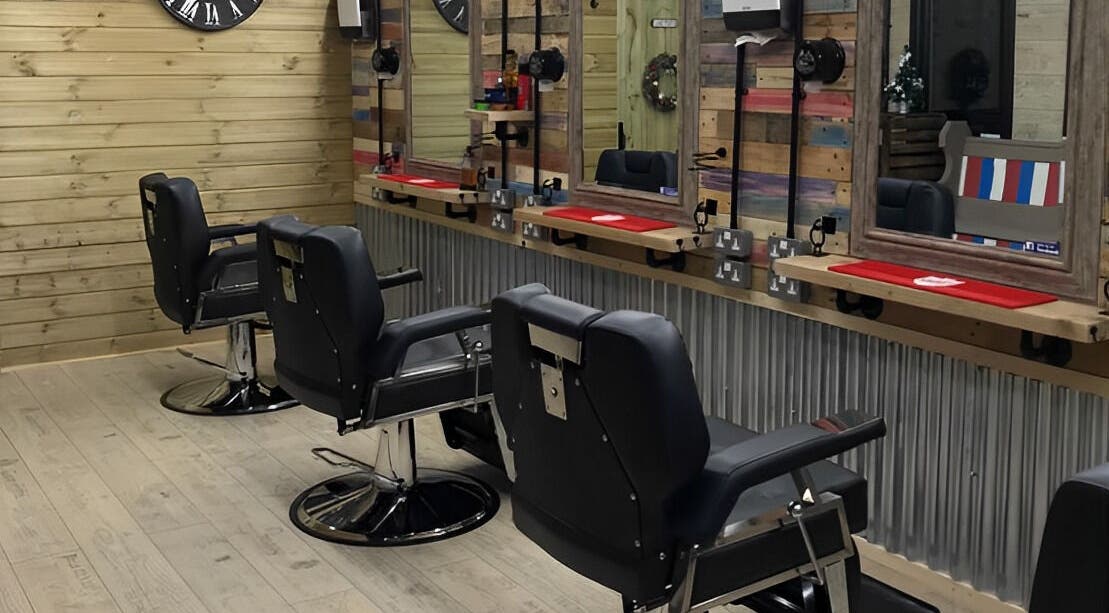 Stylish barber chairs at The Barber Shack, Saint Martin's, England, GB. Rustic wooden decor adds charm.