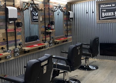 The Barber Shack at Saint Martin's, England, GB showcases modern barber chairs and stylish rustic decor.