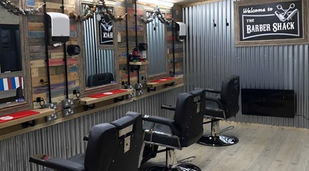 The Barber Shack at Saint Martin's, England, GB showcases modern barber chairs and stylish rustic decor.