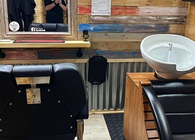 Modern barber chair and wash station at The Barber Shack in Saint Martin's, England, GB.