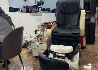 Relax in Glammy Beauty's premium spa chair in London, England, GB, surrounded by wellness essentials.