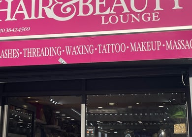 Exterior of Glammy Beauty, London, England, GB, showcasing its vibrant pink beauty lounge signage.