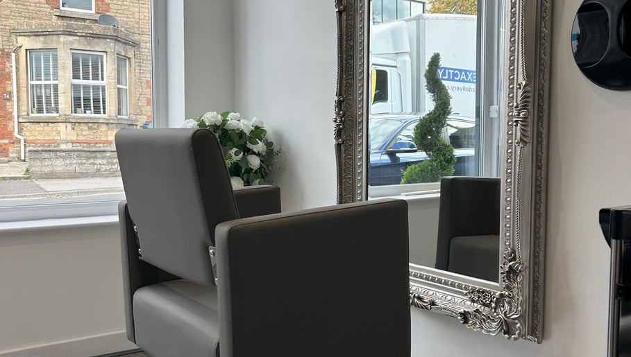 Elegant salon chair and ornate mirror at Prestige Hair Salon in Chippenham, England, GB.