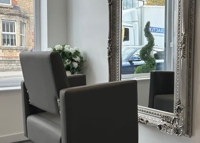 Elegant salon chair and ornate mirror at Prestige Hair Salon in Chippenham, England, GB.