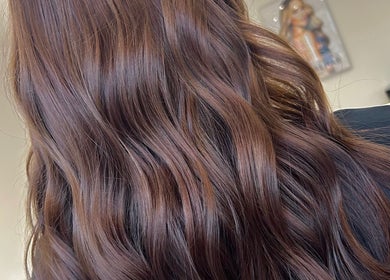 Rich brown wavy hair styled at Prestige Hair Salon, Chippenham, England, GB.