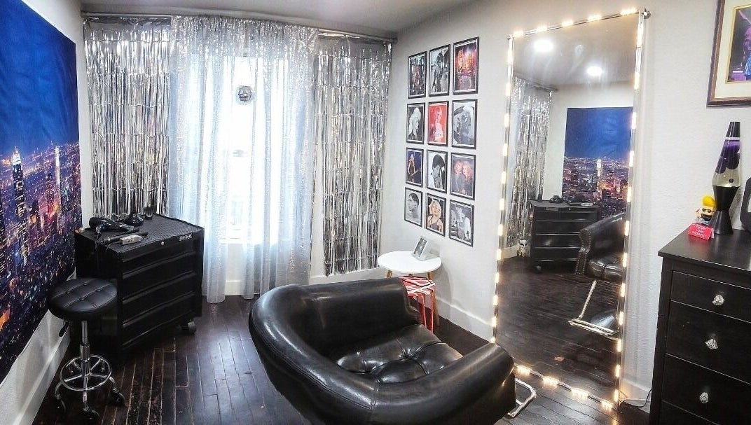 Chic salon interior at Jonny Styles, Austin, Texas, US with a large mirror and modern decor.